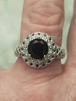 New 925 silver ring with black sapphires in it size 7.5.