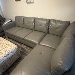 Grey sectional with ottoman