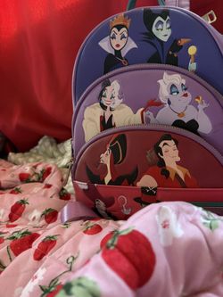 The Loungefly Disney Villains Color Block Zip Around Wallet And Backpack