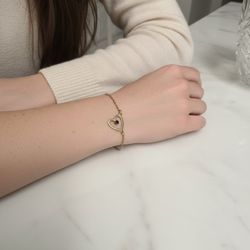 Vintage Avon Gold-Tone Open Heart Bracelet with Purple Stone