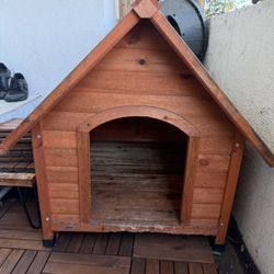 Wooden Dog House – Solid, Weathered, Structurally Sound