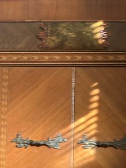 Antique Wood Cabinet with Ornate Metal Hardware