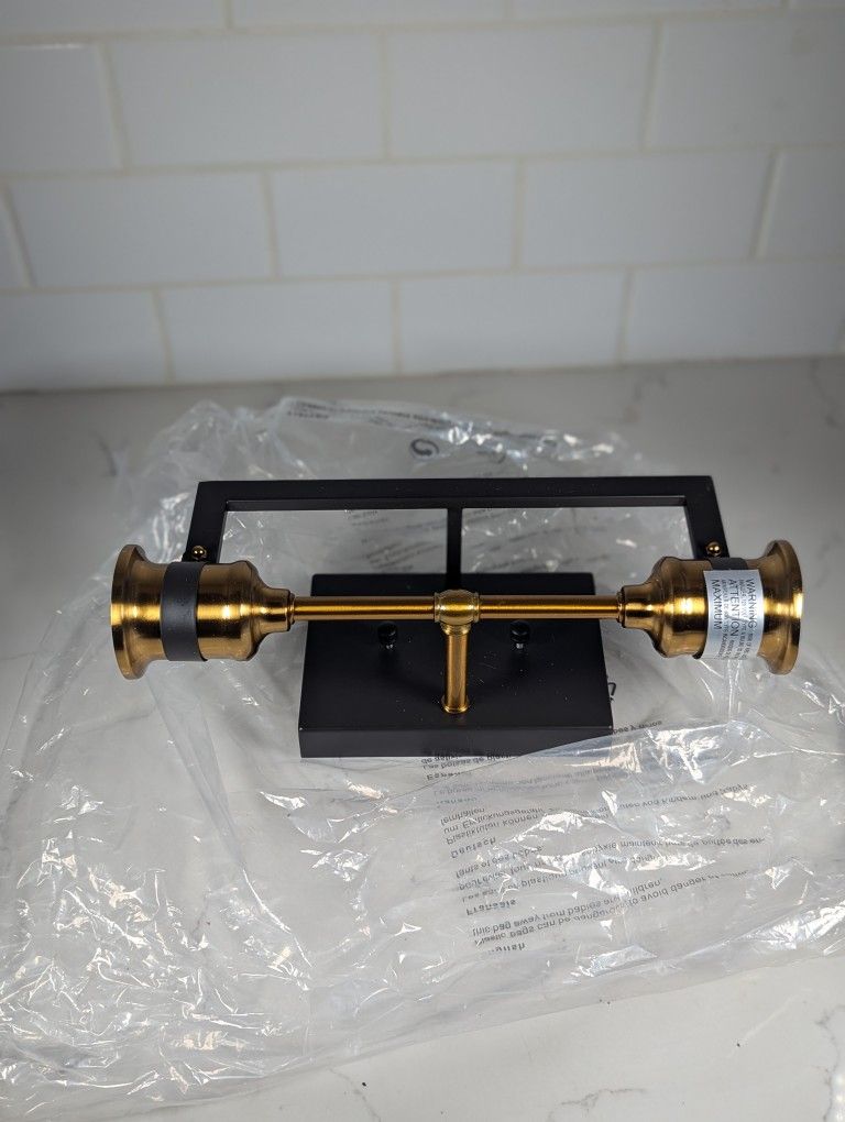 Nuvo 60-6972 Intention 2-Light Vanity light fixture in a warm brass and black finish.