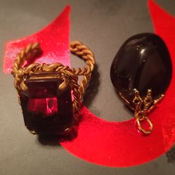 Dark purple stones with gold tone. No stamp. $50.00 Firm
