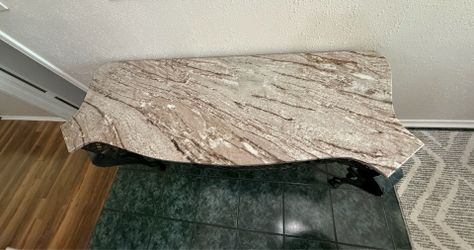 marble top table with sturdy iron legs