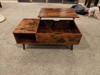 Coffee table with adjustable top