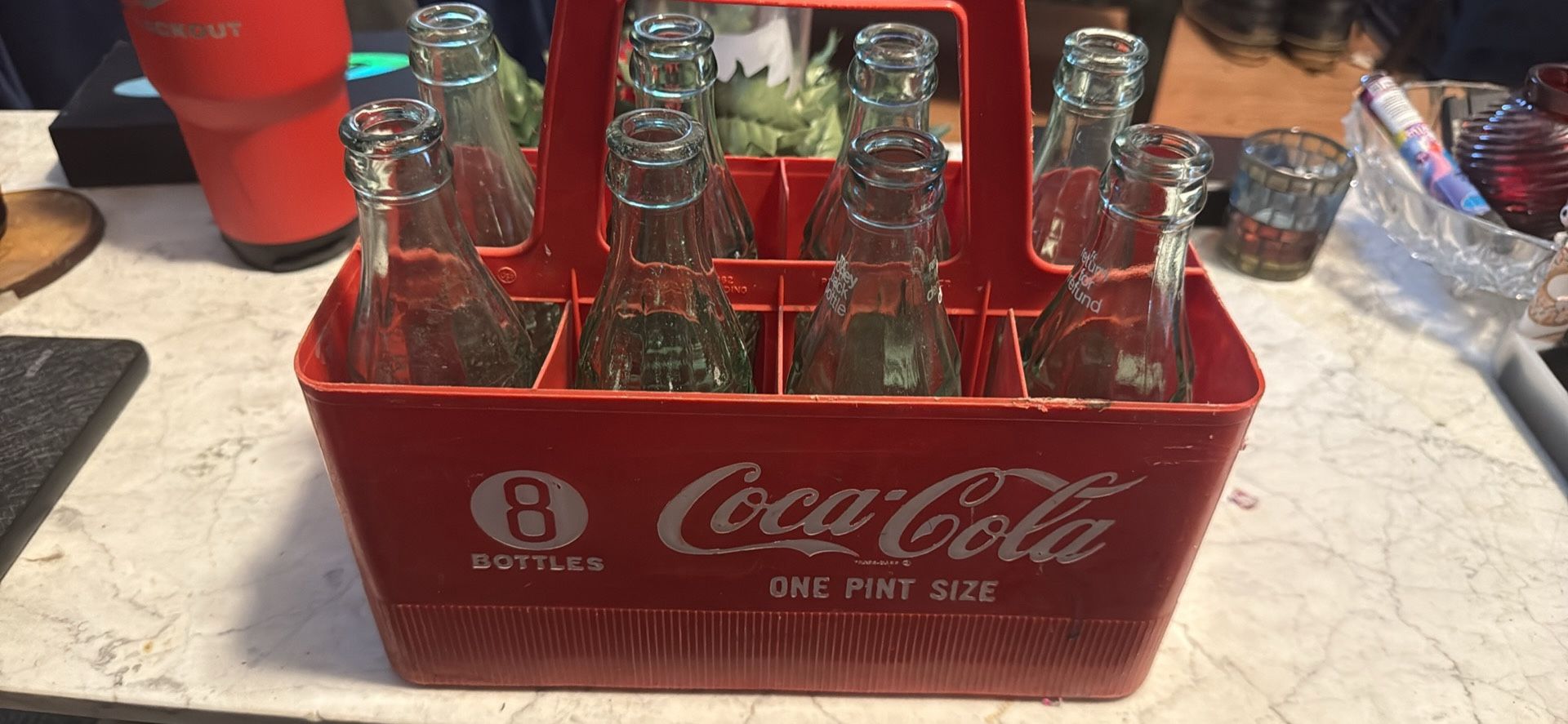 Vintage Coca-Cola bottles with crate