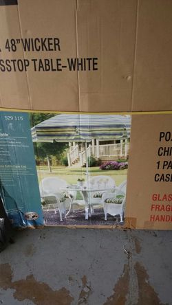 48" round wicker table brand new it box.