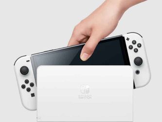 nintendo switch oled con juegos zelda breath of the wild y zelda tears of the kingdom