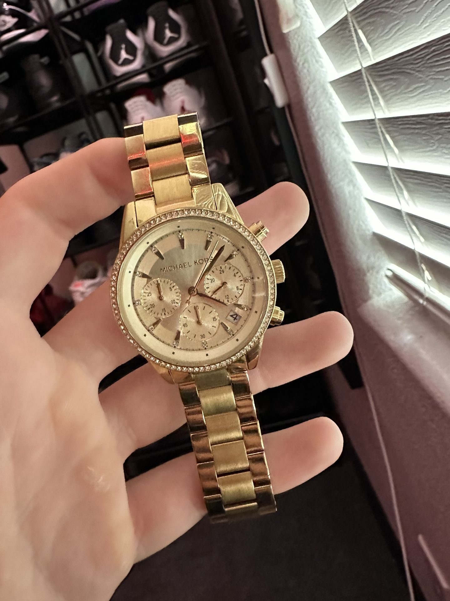 gold and Diamond Michael Kors wrist watch 