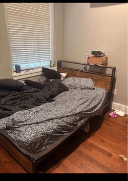 Likely used Queen bed frame + free mattress that has a cover