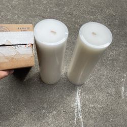 Two White Medium Sized Candles