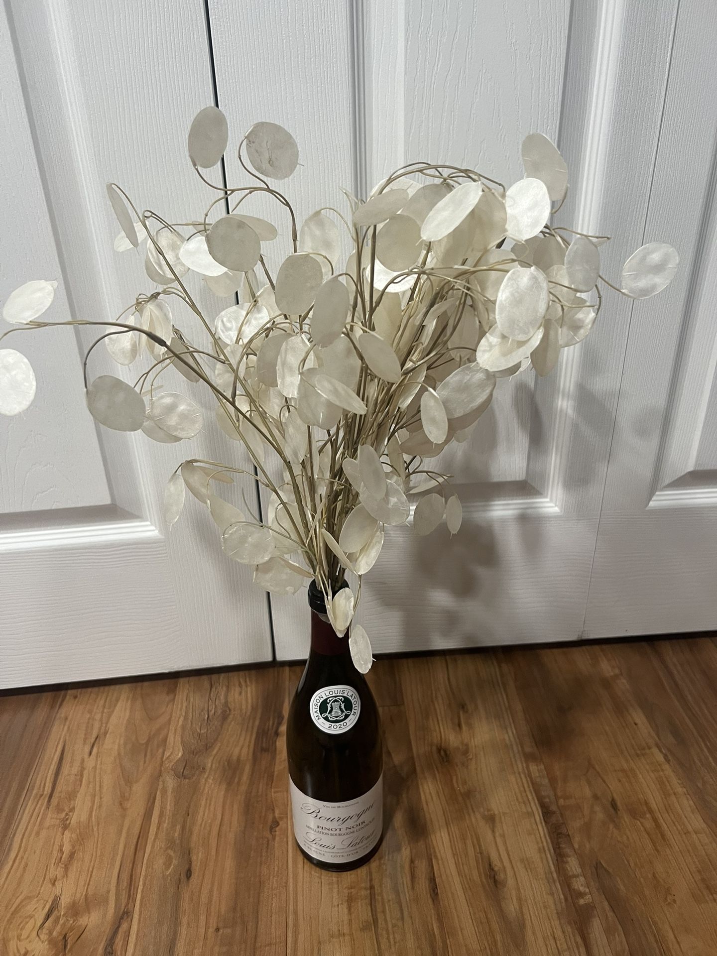 Recycling wine bottle with fake plant