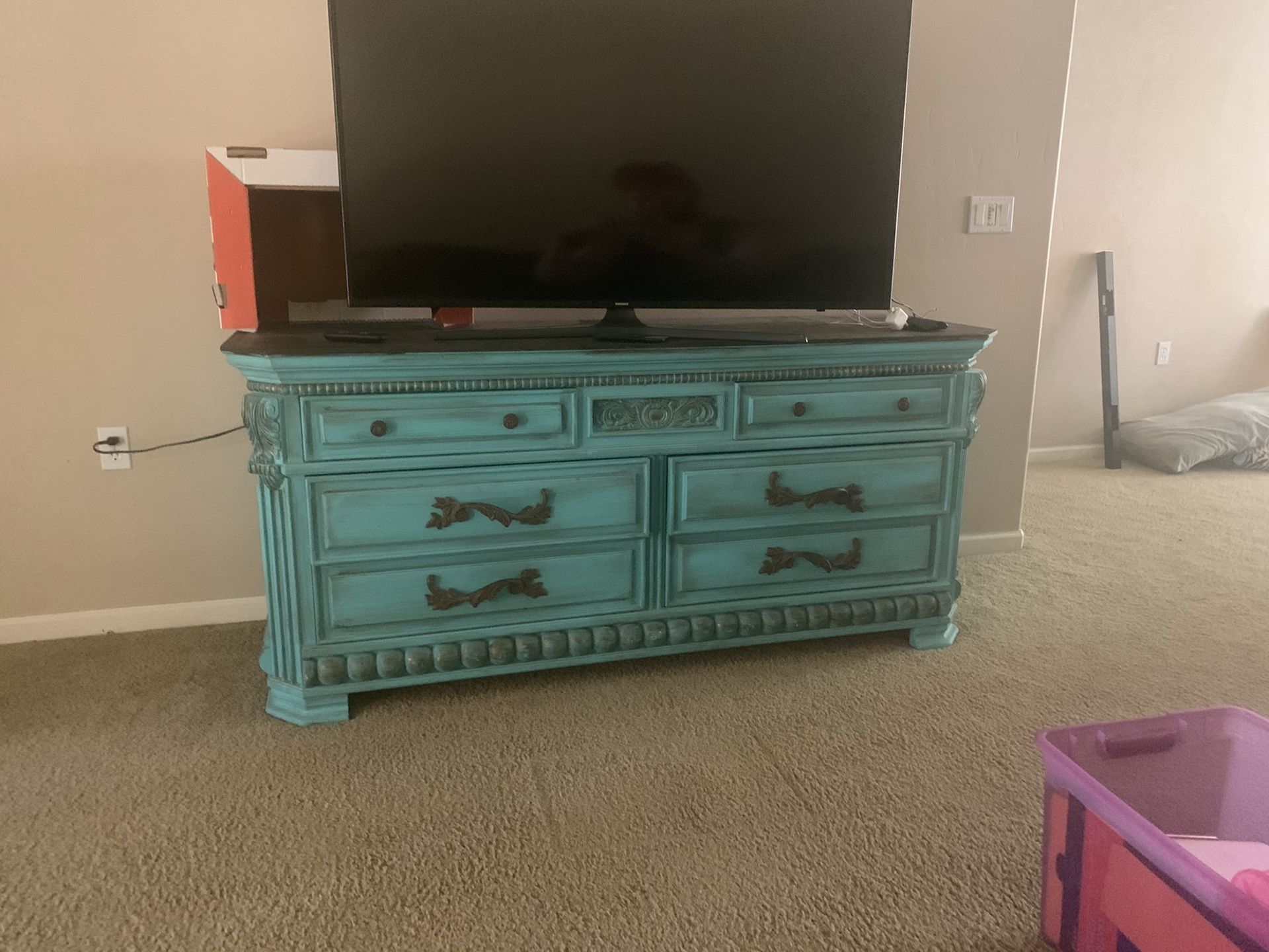 Very nice entertainment center/dresser/console table. Very solid and heavy. All drawers work perfect