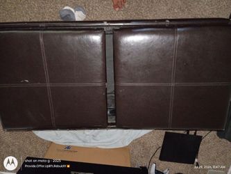 Brown leather ottoman with storage space