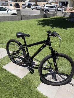 Mongoose Excursion is a black mountain bike