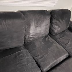 Black Couch, Two Pieces, With Ottoman And Three Cushions