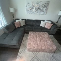 Grey Sectional Couch , Ottoman , And Rug 