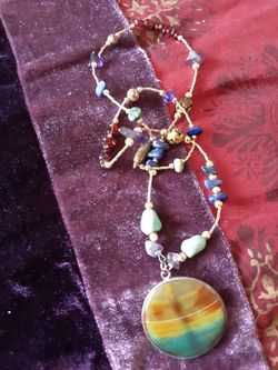 Beautiful semiprecious stone and brass/goldtone beads with large glass pendant