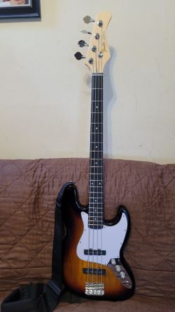 UNBRANDED STANDARD JAZZ BASS, WITH FENDER DECAL IN SUNBURST COLOR.