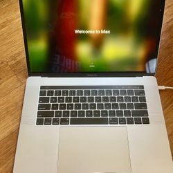 A1990 15” Silver Touchbar Macbook Pro i7 16Gb Ram 512Gb SSD OS Sequoia