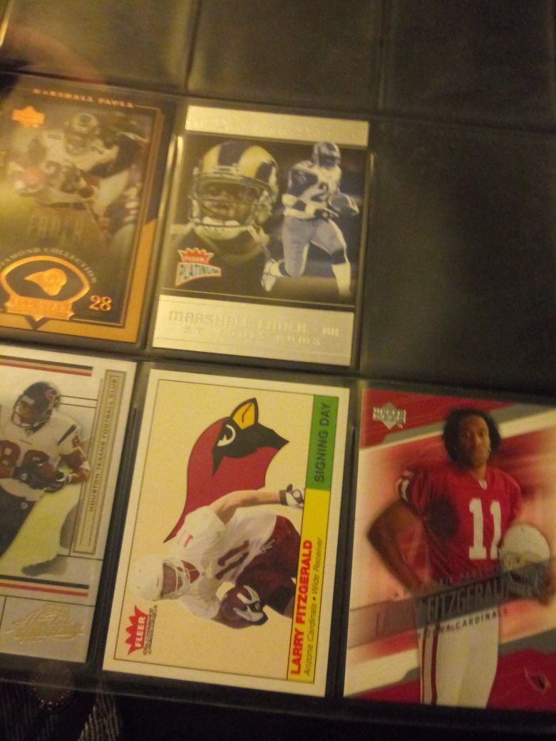 Larry Fitzgerald Eli Manning priest Holmes jersey card and many more collectibles