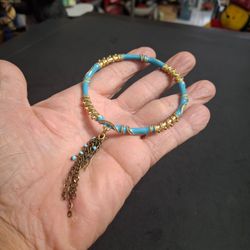 Turquoise Enamel & Textured Rope Goldtone Rigid Bangle Bracelet Featuring An Attached Cascading Chain Tassel Charm 2 5/8" Opening
