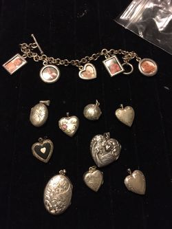 9 sterling silver lockets 1 sterling silver picture charm bracelet and 1 Victorian style brass locket