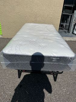 Brand new full-size plush mattress in plastic