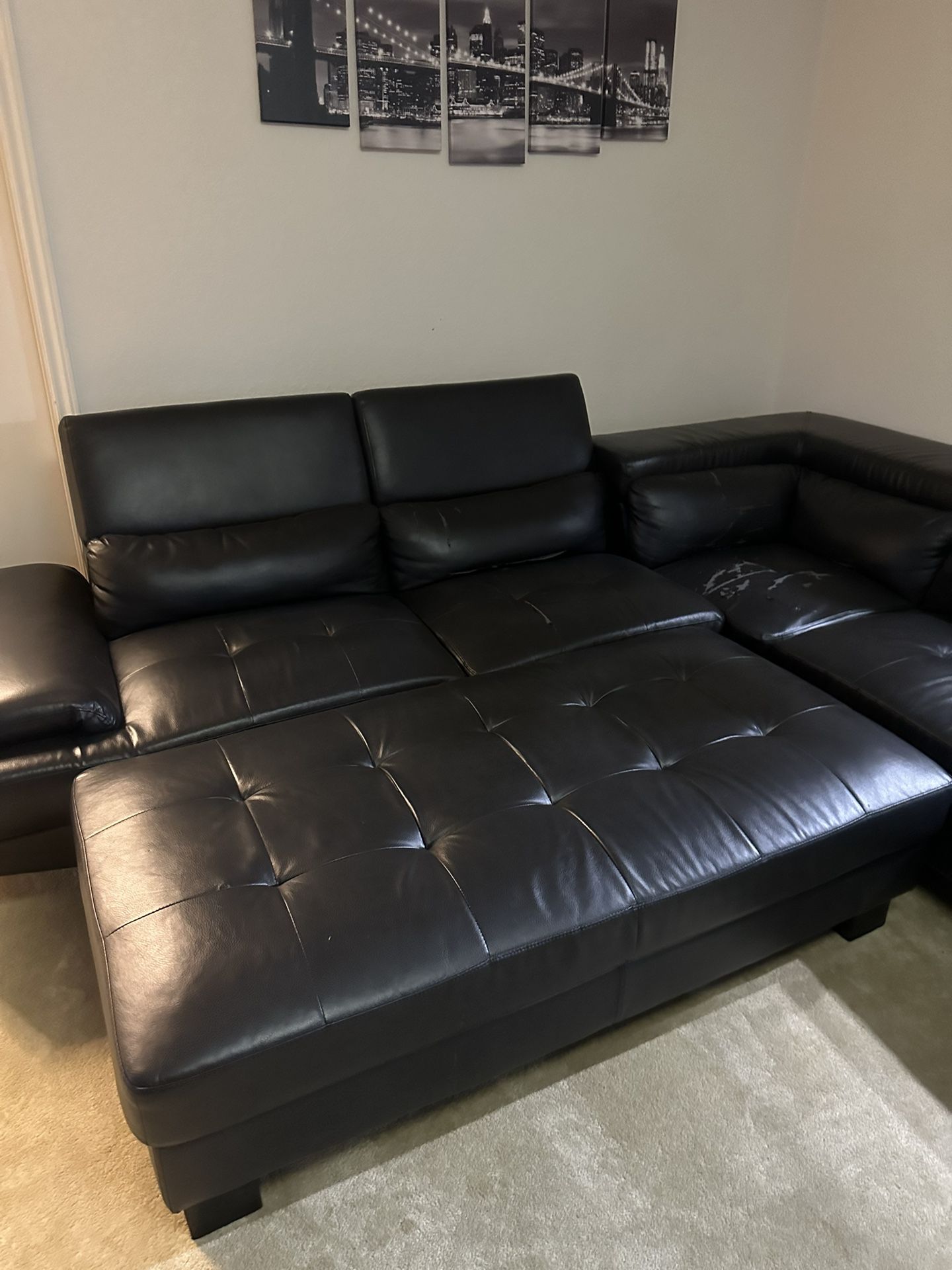 Black sectional with ottoman