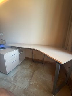 Curved long desk with built-in shelves