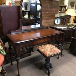 Wooden mirrored vanity, made by Sligh Furniture, floral oil painting