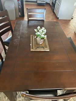 Solid dark wood Dinning room table and chairs