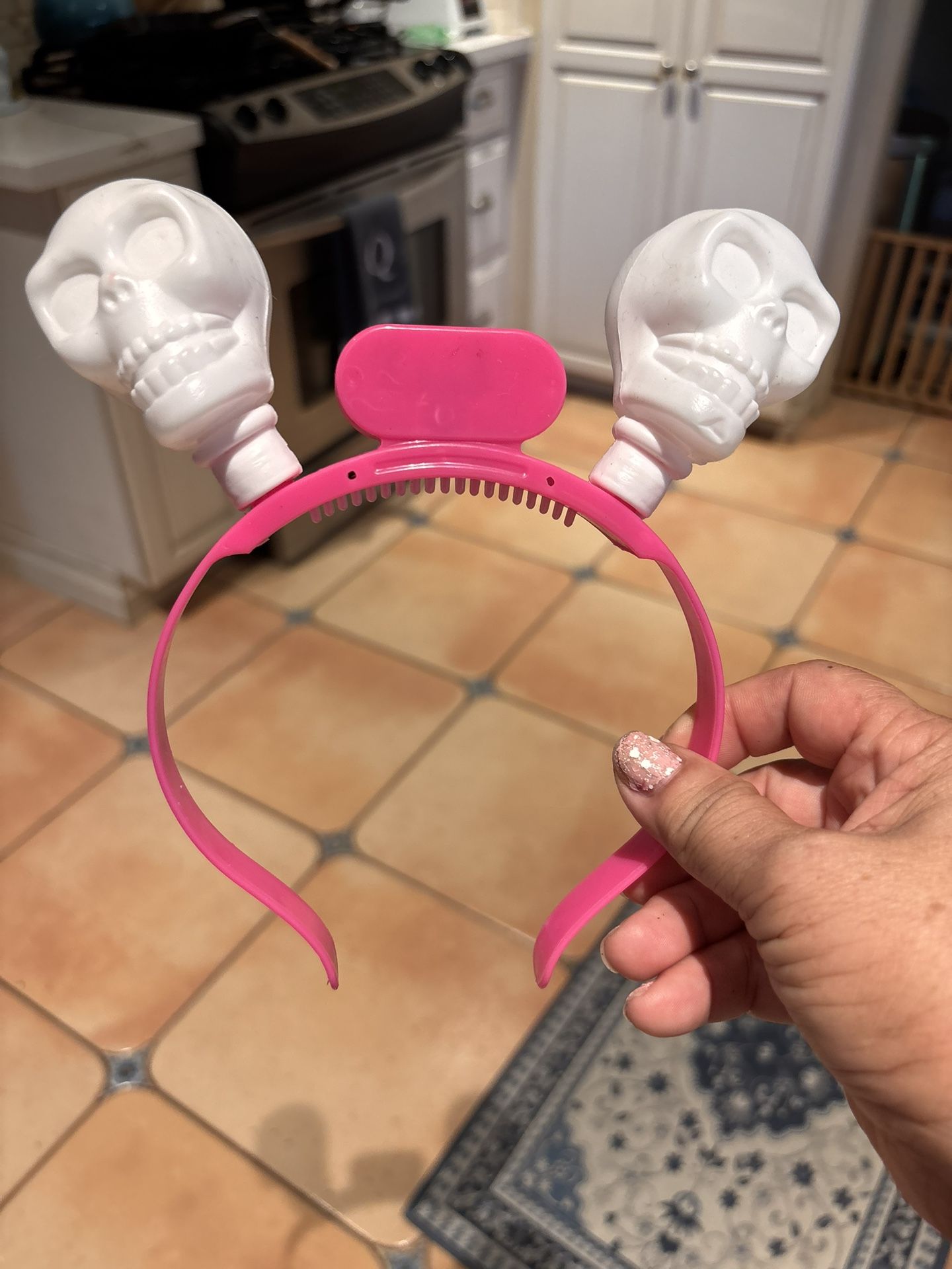 halloween skull head headband lights up with 2 small round batteries