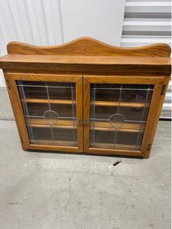 Wall hung curio cabinet