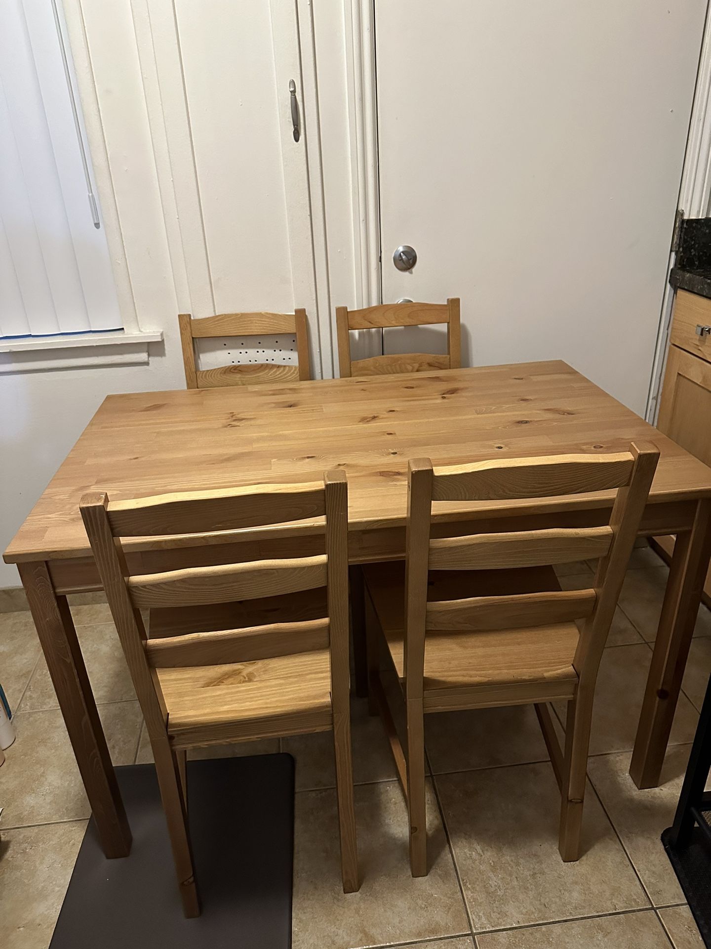 Wooden Table With Four Chairs