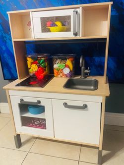 Kids kitchen with lots of food and accessories
