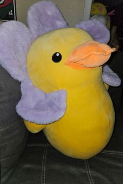 22-inch Way to Celebrate! Large Easter Flower Duck Plush in yellow with purple flower petals around its head