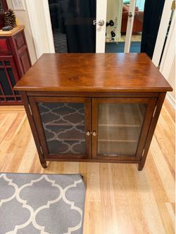 Wooden cabinet with glass doors