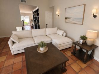 White couch with matching ottoman