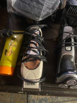Hair clippers and beard trimmers bunch of attachments and aftershave