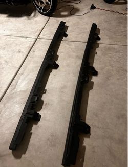 Pair of Black Jeep wrangler rock rails