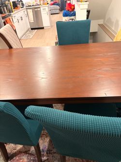 Wood Dining Table with Teal Upholstered Chairs