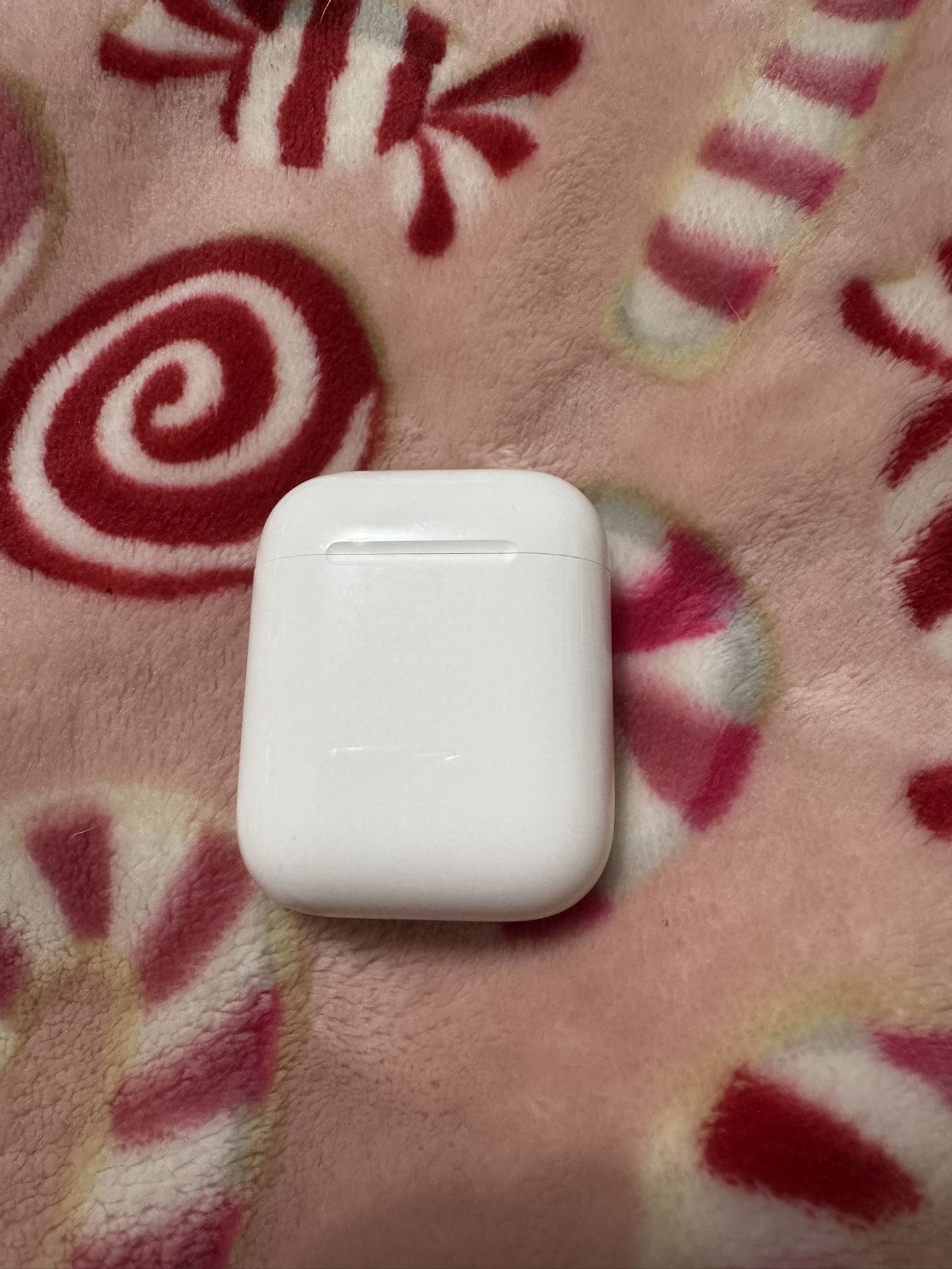 Apple AirPods 2 Generation With Charging Cases And Charging Cord.