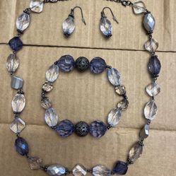  Faux crystal beaded necklace, earrings, and bracelet set.