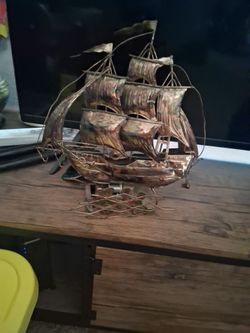 Vintage copper musical sailboat