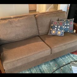 Mission style brown fabric sofa with wood arms