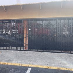 Scissor Gate Protects Store Front Security.
