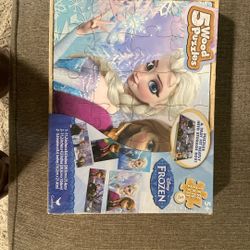 Frozen    Five puzzle set with carrying case.