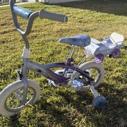 For sale: Frozen kids’ bicycle, 12.5-inch wheels, with training wheels.